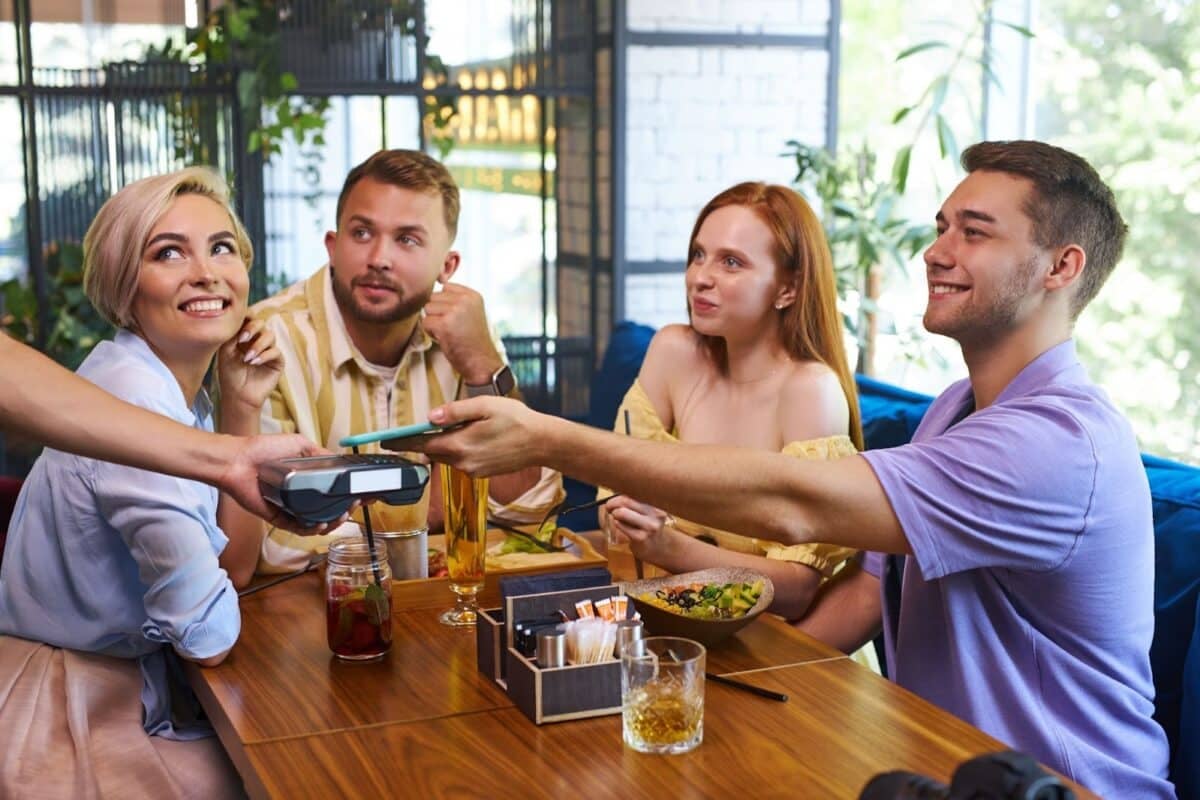 Man picking up the check for lunch with clients. 