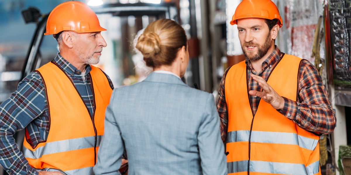 An agent talking to two contractors.