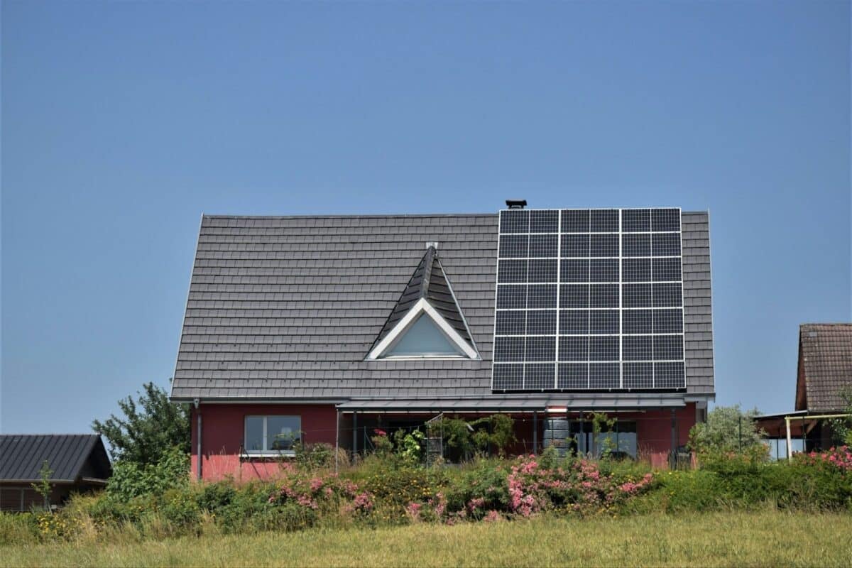 A house with a solar panel on the roof