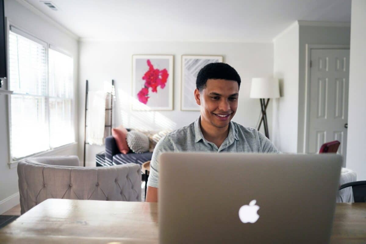 Man sitting on a chair in front of his computer