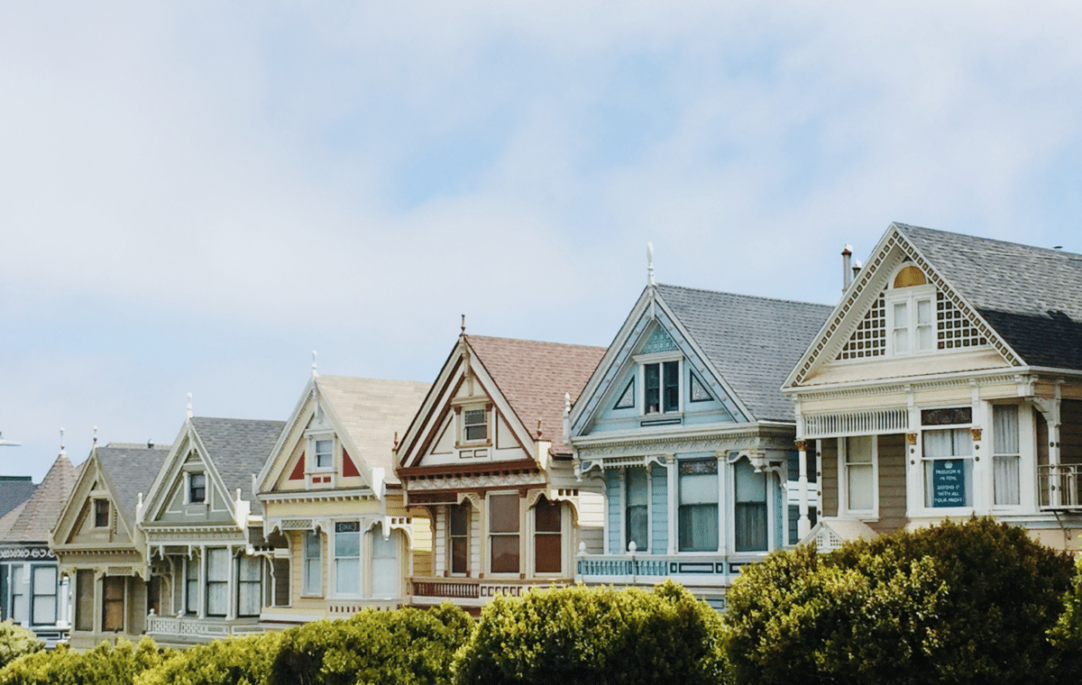 Row of small houses in different colors.