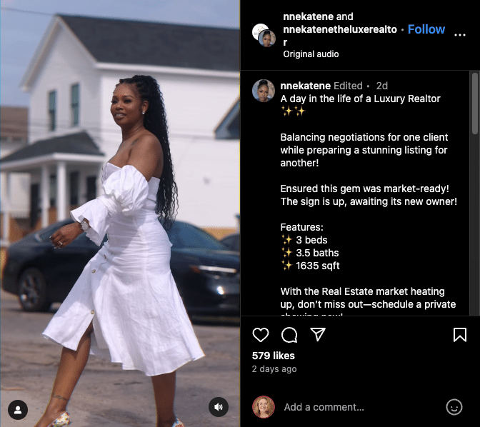 Screenshot of a smiling real estate agent walking across the street wearing a flowing white poplin dress with flowery heels.