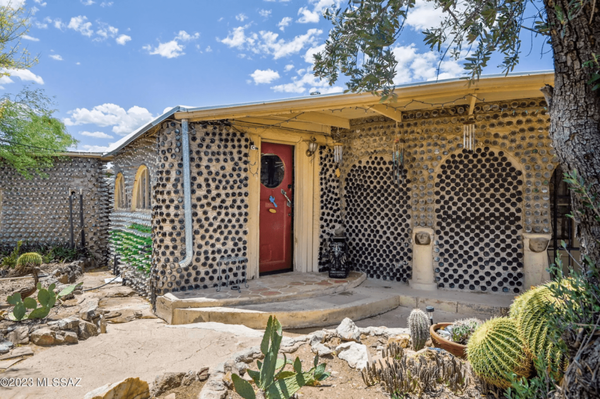 A house covered in beer bottles