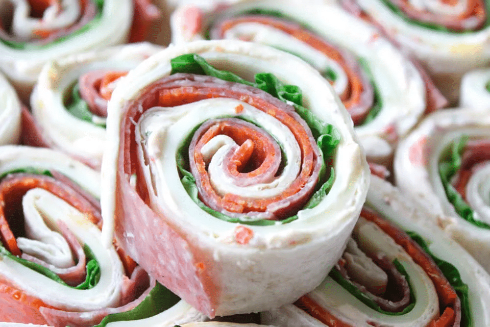 Pinwheel sandwiches stacked on top of each other.