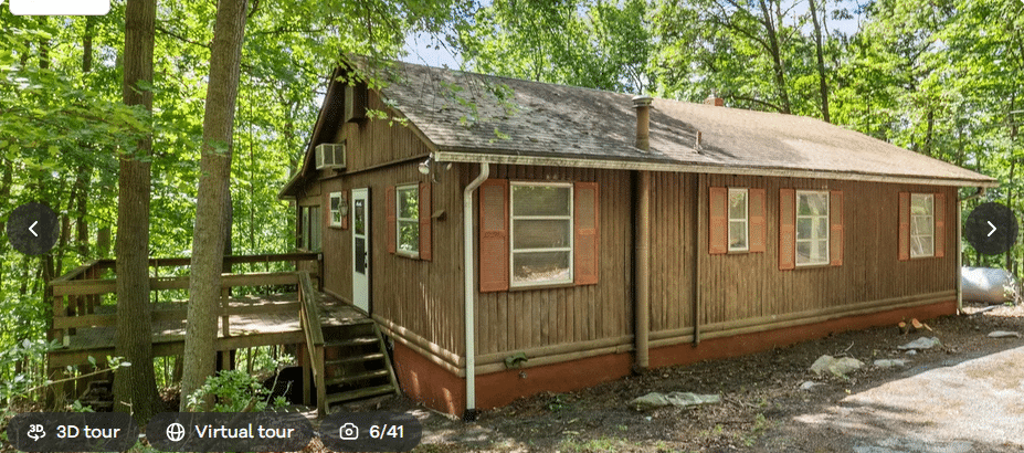 The exterior of an as-is- home for sale.