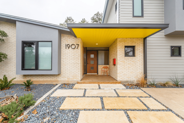 A modern brick house with stone steps