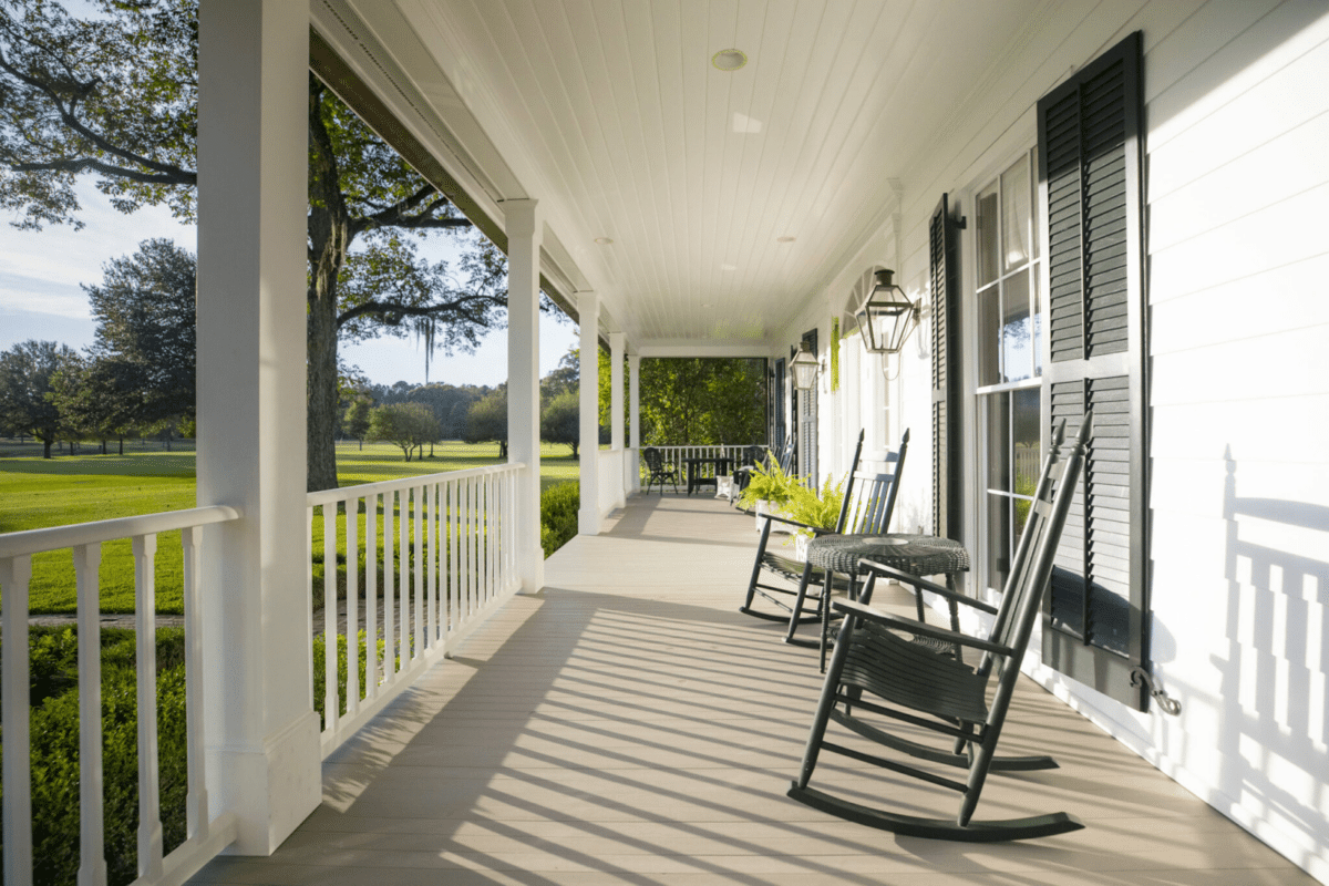 A porch with outdoor seating and modern flooring