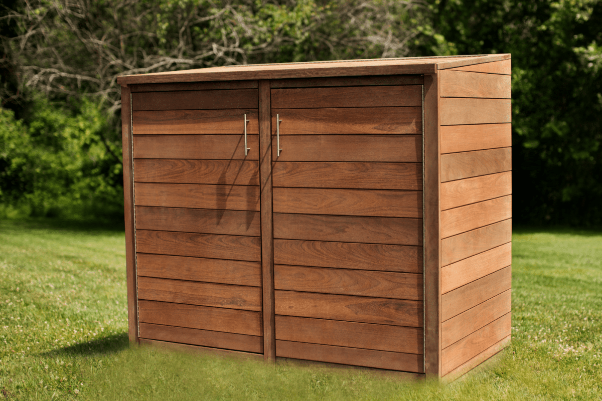 A wooden trash enclosure